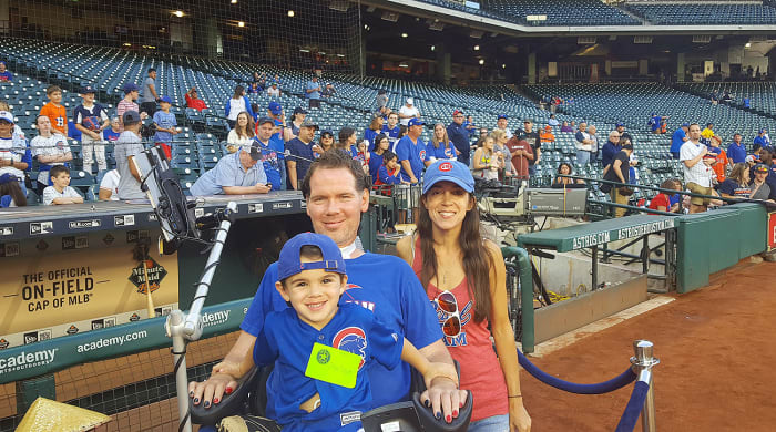 Steve Gleason, his son Rivers and his wife Michel take in a Cubs game.